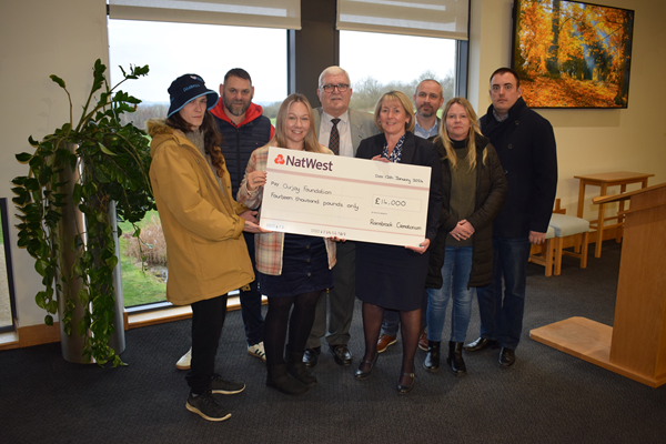 Sean Clarke, OurJay Foundation ambassador, Jem Issitt, Naomi Rees-Issitt, Cllr Derek Poole, Lorraine Marley, Rugby Borough Council’s bereavement services manager, Cllr Simon Ward, OurJay Foundation trustee Tracey Brand and Cllr Mike Hallam attended the cheque presentation at Rainsbrook Crematorium.