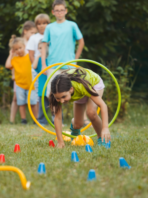 child climbing through a hoop